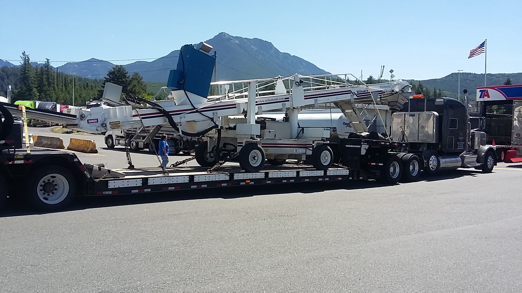 Wilson grain conveyer transported on a trailer